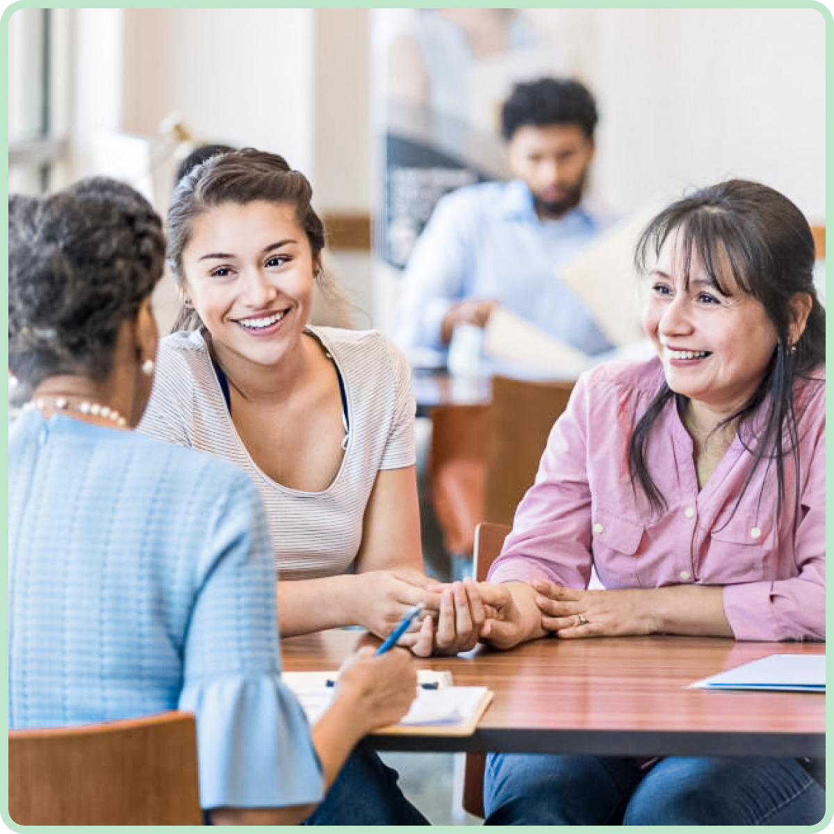 Two people in suits shaking hands